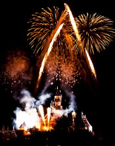 disneyland castle with fireworks in sky above