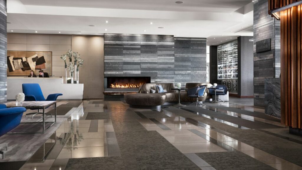 two people stand behind the desk in the four seasons seattle lobby